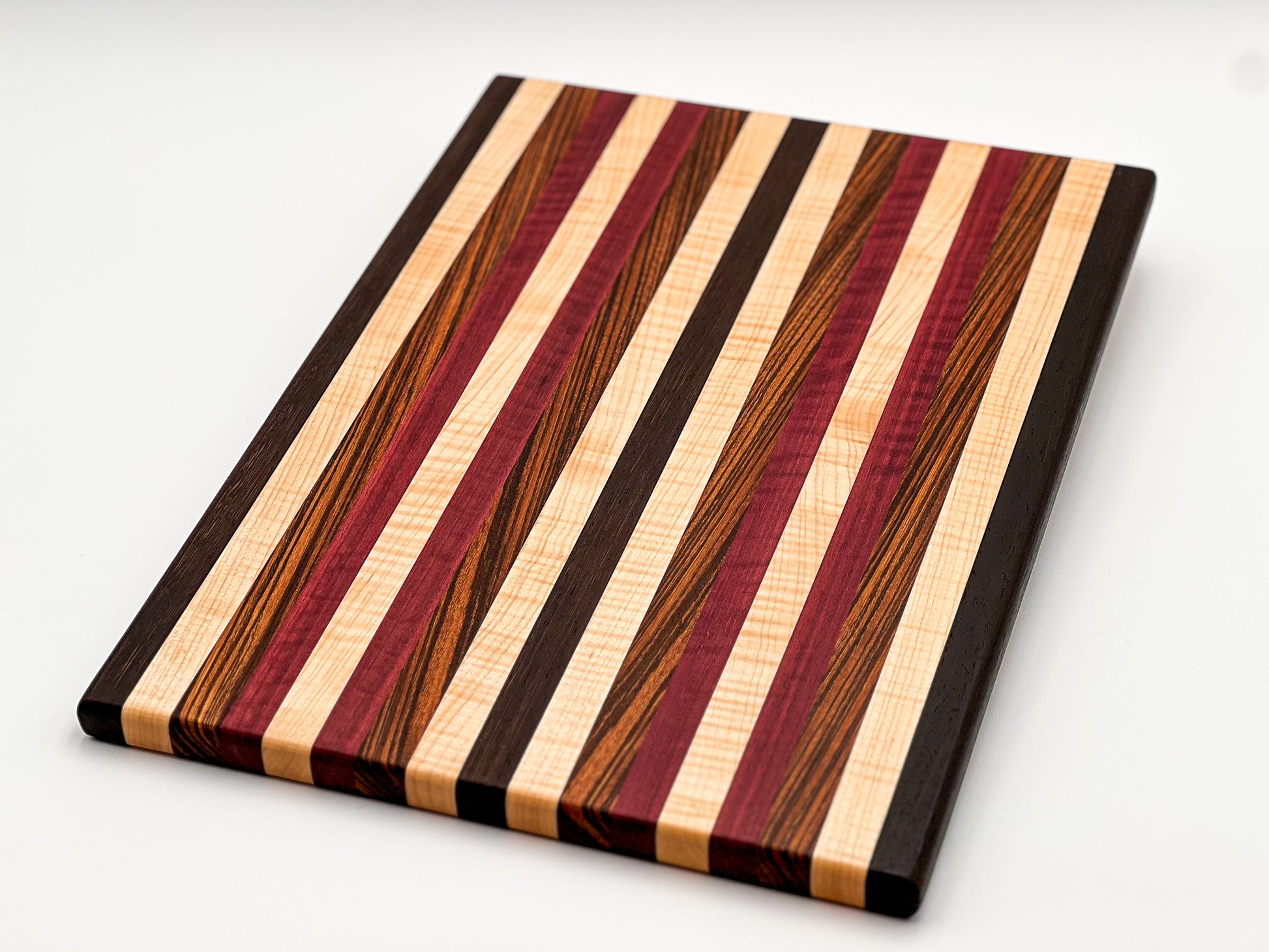 Small Zebra Wood, Wenge, Purple Heart, and Maple Cutting Board — The  Bearded Ginger Woodshop